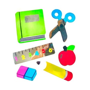 May include: A set of colorful school supplies including a green book, a red apple, a yellow pencil, a blue and pink eraser, a ruler with numbers 1-6, and a pair of blue scissors.