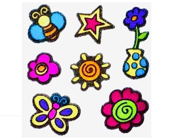 May include: A collection of seven colorful felt stickers featuring a bee, a star, a flower in a vase, a pink flower, a sun, a butterfly, and a multi-colored flower. Each shape has a thick black outline and vibrant, saturated colors.