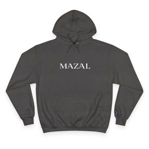 May include: Dark gray hoodie with the word "MAZAL" printed in white across the chest. The hoodie has a hood with a drawstring, a front pocket, and the Champion logo on the left sleeve.