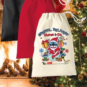 May include: Three Christmas gift bags, one black, one red, and one natural canvas with a blue Stitch character wearing a Santa hat and holding a gift box. The canvas bag has the text "Special Delivery Ohana & Co." and "To: Luna".