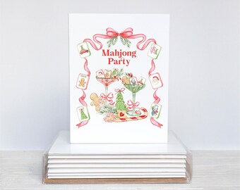 May include: A white card with a watercolor illustration of a Christmas-themed Mahjong Party. The design includes a red bow, pink ribbons, and festive elements like a gingerbread man, Christmas tree, and candy cane. The words "Mahjong Party" are in red.