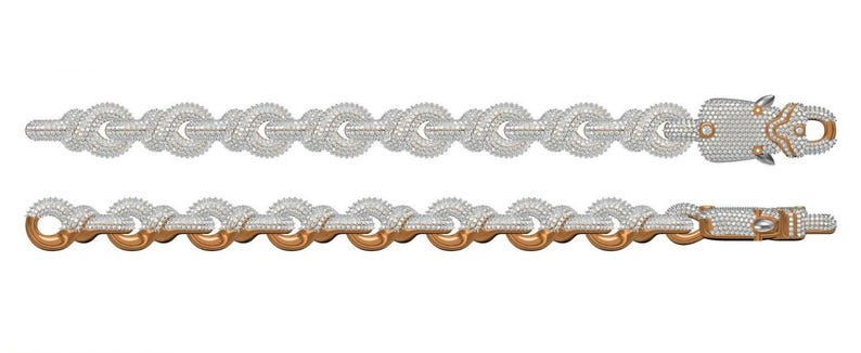 Peut inclure: Deux bracelets incrust&eacute;s de diamants. Le bracelet sup&eacute;rieur est enti&egrave;rement argent&eacute;, tandis que le bracelet inf&eacute;rieur a des maillons dor&eacute;s. Les deux bracelets pr&eacute;sentent un motif de n&oelig;ud et une fermeture &agrave; fermoir. Les fermoirs sont &eacute;galement incrust&eacute;s de diamants.