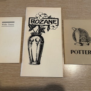 May include: Three vintage brochures for Weller Pottery, Rozane Pottery, and Pottery. The Rozane brochure features a black and white illustration of a vase with flowers. The Weller Pottery brochure has the text "Weller Pottery" printed on the front. The Pottery brochure has the text "POTTERY" printed on the front.