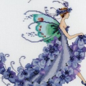 May include: A cross-stitch pattern featuring a fairy with purple flowers and green wings. The fairy is wearing a purple dress and has a flower crown on her head.