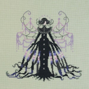 May include: A black and purple cross-stitch embroidery of a woman in a long gown with a spiderweb-like design. The woman has a crown of thorns and a veil.