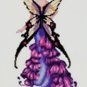 May include: A purple and white butterfly fairy with a flower in her hair. The fairy is wearing a purple dress with a butterfly wing design.
