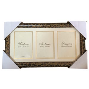 May include: A triple photo frame with a leopard print border and three cream-colored mat openings. The text "Sixtrees Gallery Collection" is printed on each mat. The frame is packaged in a white cardboard box.