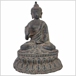 May include: A dark gray stone Buddha statue in a seated meditation pose with a hand gesture. The statue is on a lotus base with intricate carvings.