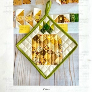 May include: A printable pattern for a quilted hot pad featuring a pineapple design. The pattern is called "Pineapple Pieces" and is designed by Morning Stroll Designs. The pattern is for an 8-inch block.