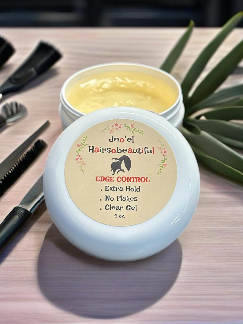May include: A white jar of clear edge control gel with the brand name "Jno'el Hairsobeautiful" and the text "EDGE CONTROL - Extra Hold - No Flakes - Clear Gel 4 oz."