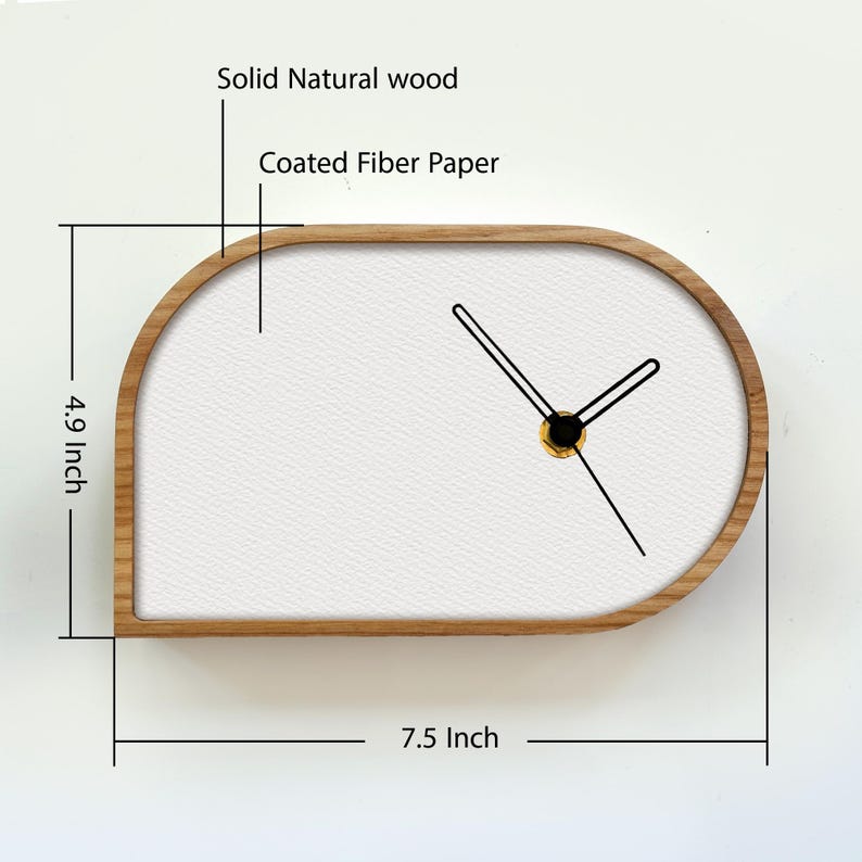 May include: A wall clock with a solid natural wood frame and a white coated fiber paper face. The clock has black hands and measures 7.5 inches in width by 4.9 inches in height. The design features a rounded, asymmetrical shape.