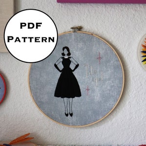 May include: A black and white embroidery pattern of a woman in a dress, with the words "PDF PATTERN" in a circle above the embroidery hoop.