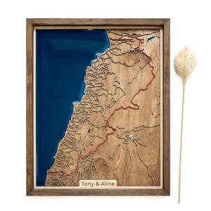 A wooden map of your favourite place enclosed in a wooden frame. It has 3D city streets and epoxy resin water. By adding a pin in a important place for you and an engraving you will make a personalized gift.