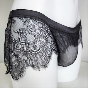 Men crossdresser black lace thong panties. Sissy lingerie lacy larger front, no pouch.