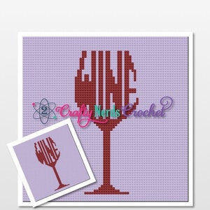 May include: A purple and red cross-stitch pattern of a wine glass with the word "WINE" spelled out in the glass. The pattern is for a small project, with a smaller version of the pattern shown in the bottom right corner.