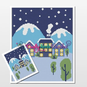 May include: A cross-stitch pattern featuring a winter scene with a blue sky, white snow-capped mountains, a row of houses with lit windows, and green trees. The pattern is on a white background.