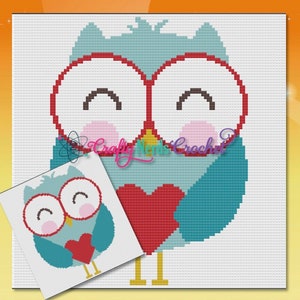 May include: A cross-stitch pattern featuring a cartoon owl with large, round eyes and a red heart. The owl is primarily blue and white, with pink accents. A smaller version of the owl is in the lower left corner. The text "Crafty Momma Crochet" is visible.