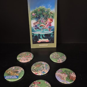 May include: A Disney's Animal Kingdom English guidemap featuring Zootopia characters on the cover, accompanied by five circular pin-back buttons, each displaying a different color-coded section of the park map including Africa, Asia, and Pandora.
