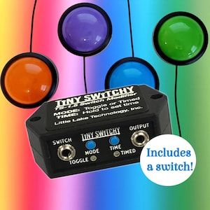 May include: A black Tiny Switchy TS-1.5 Switch Modifier with the text "Includes a switch!" and four colored buttons: orange, purple, blue, and green. The device has toggle, mode, and time settings.