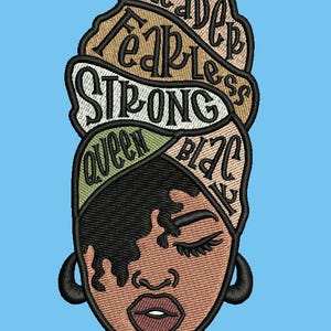 May include: Embroidered patch depicting a woman with a headscarf. The headscarf features the words "leader", "fearless", "strong", "queen", and "black" inscribed on it. The woman has brown skin, closed eyes, and a pink mouth.