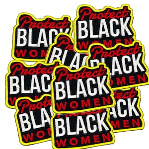 May include: A set of eight black and yellow iron-on patches with the text "Protect Black Women" in white and red lettering.