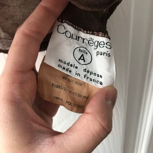 May include: White tag with black text reading "Courr&egrave;ges taille A paris modele depose made in france DO NOT IRON TISSUS/MAT 100% POLYAMIDE"