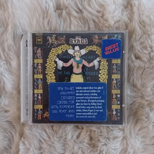 May include: A CD of The Byrds' album "Sweetheart of the Rodeo" in a clear plastic case. The album cover features a woman in a cowgirl outfit with the album title. A blue sticker reads "Best Value".