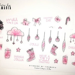 May include: Pink and black Christmas themed stickers with various designs including a gingerbread man, a Christmas tree, a stocking, a candy cane, a coffee cup, and ornaments. The stickers also include text in Finnish and English, such as "Hyvää Joulua" and "Have a Jolly Christmas".