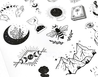 May include: A set of black and white stickers featuring various celestial and nature-inspired designs. The stickers include a crescent moon, a bee, a mountain range, a pipe, and a crescent moon with stars.