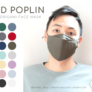 May include: A green, gray, red, navy blue, olive green, light blue, gray, yellow, purple, pink, light blue, black, and white color palette. A person wearing a green origami face mask. The text "3D POPLIN ORIGAMI FACE MASK" is at the top of the image. The text "@ohashii_shop | ohashii.etsy.com | ohashii.com" is at the bottom of the image.