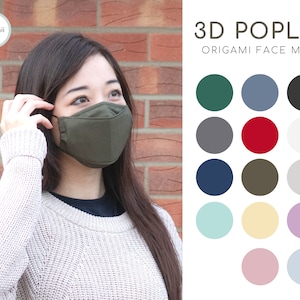 Może przedstawiać: Kobieta w zielonej 3D poplinowej masce origami. Obraz zawiera również paletę kolorów z 12 różnymi kolorami.