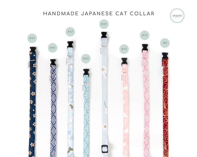May include: A collection of handmade Japanese cat collars in various patterns and colors. The collars feature floral, wave, and cloud designs in shades of blue, pink, and red. Each collar has a black buckle and is labeled with a number.