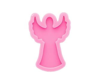 May include: Pink silicone mold shaped like an angel with outstretched wings. The mold is designed for crafting and creating resin art.
