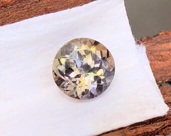 Unheated Pleochroism Tanzanite Gemstone, Multi Color Round Cut (0.60 Carats)