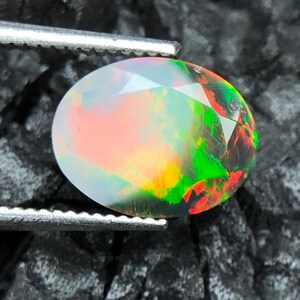 Natural Rainbow Fire Black Ethiopian Opal, 10x7 MM Ring Size Faceted Oval Opal, 1.75 Ct Blue Green Red Fire Loose Opal, October Birthstone.