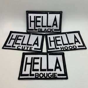 May include: Four white iron-on patches with black outlines and text. The patches read "Hella Black", "Hella Cute", "Hella Hood", and "Hella Bougie".