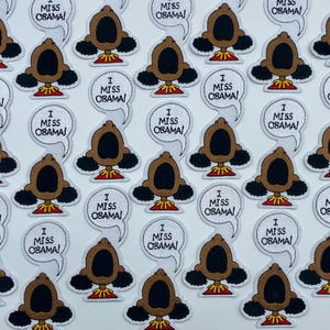 May include: A collection of embroidered iron-on patches featuring a cartoon character with the text "I Miss Obama!" in a speech bubble.