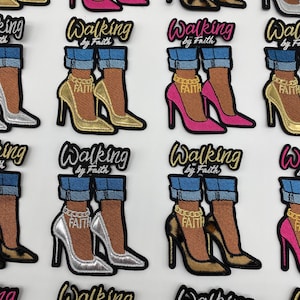 May include: A collection of embroidered patches featuring legs in blue cuffed jeans and high-heeled shoes in various colors including gold, pink, silver, and leopard print. Each patch includes the text Walking by Faith and a gold chain ankle bracelet.