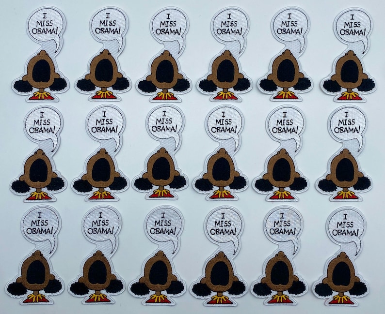 May include: Twenty-four white iron-on patches with a cartoon character and the text "I Miss Obama!" printed in black.