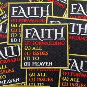May include: A close-up of several black fabric patches with gold trim. The patches feature the word "FAITH" in white lettering and an acronym that reads "(F) Forwarding (A) All (I) Issues (T) To (H) Heaven".