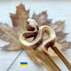 Snake. Wooden hair fork. Serpent. Woodcarving.