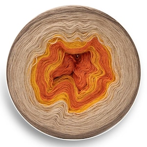 May include: A skein of yarn with a gradient of beige, orange and yellow colours. The yarn is wound into a ball shape.
