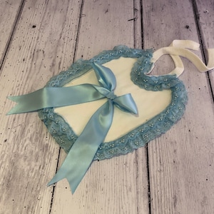 Baby’s reborn bib. Blue bow and blue embellishments.
