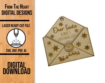 May include: A laser cut wooden envelope with a flap open, revealing the text "Dear Santa AUBREE'S CHRISTMAS LIST". The envelope has a snowflake design and a round seal with the text "NORTH POLE DEC 25 EXPRESS".