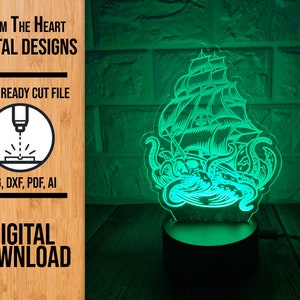 May include: A green 3D printed night light depicting a ship being attacked by a kraken. The ship has sails and a skull and crossbones on the front. The kraken has tentacles wrapped around the ship. The night light is on a black base.