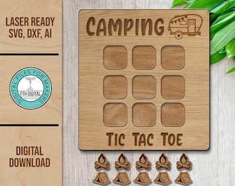 May include: A wooden tic-tac-toe game with a camping theme. The board features a camper van, nine squares, and the text "Camping Tic Tac Toe". The game includes six campfire and six tent pieces.