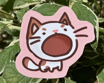 May include: A pink sticker featuring a cartoon cat with a surprised expression. The cat has brown and white fur, a pink nose, and an open mouth. The sticker is set against a backdrop of green and white leaves.