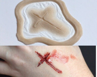 Cross scar wound prosthetic engraved