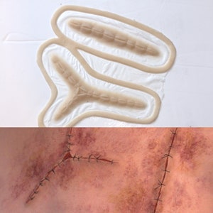 Peut inclure: Deux moules en silicone pour créer de fausses cicatrices. Les moules sont en forme de Y et ont des lignes en relief pour créer l'apparence de points de suture. L'image du bas montre une cicatrice finie avec des points de suture.