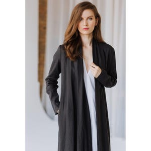 Eco-friendly women's outerwear made from natural linen, styled in a timeless, elegant silhouette.